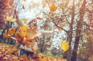 Little girl in autumn park