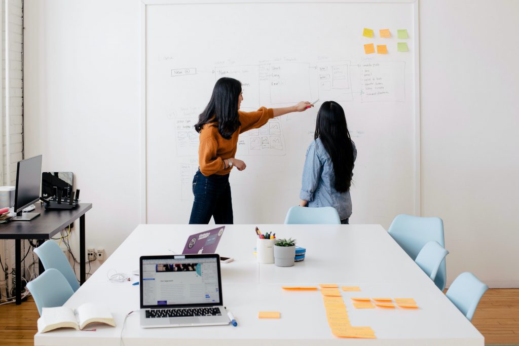 Two females discussing some data