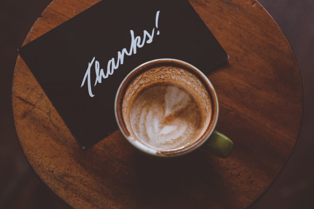 A coffee with a thanks note