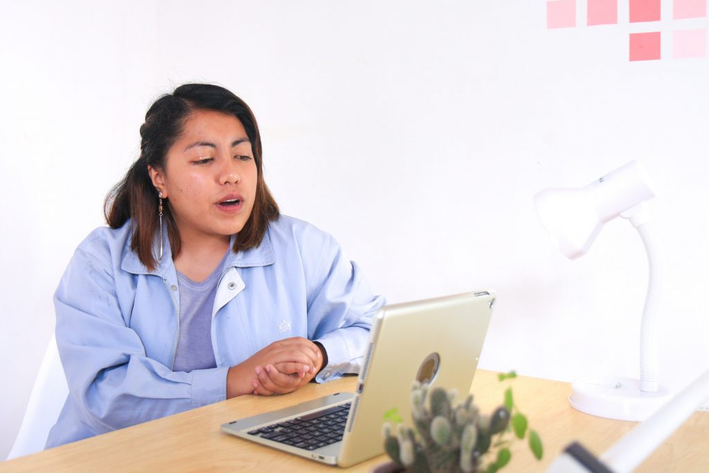 A lady on a video call on the laptop