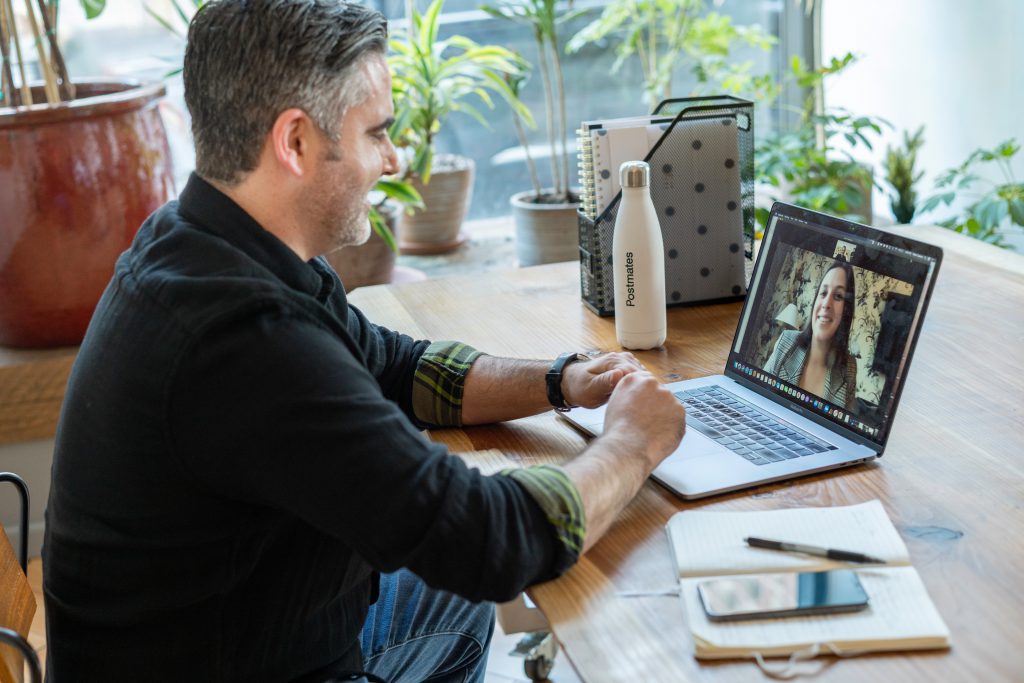  a person on a video call on his laptop