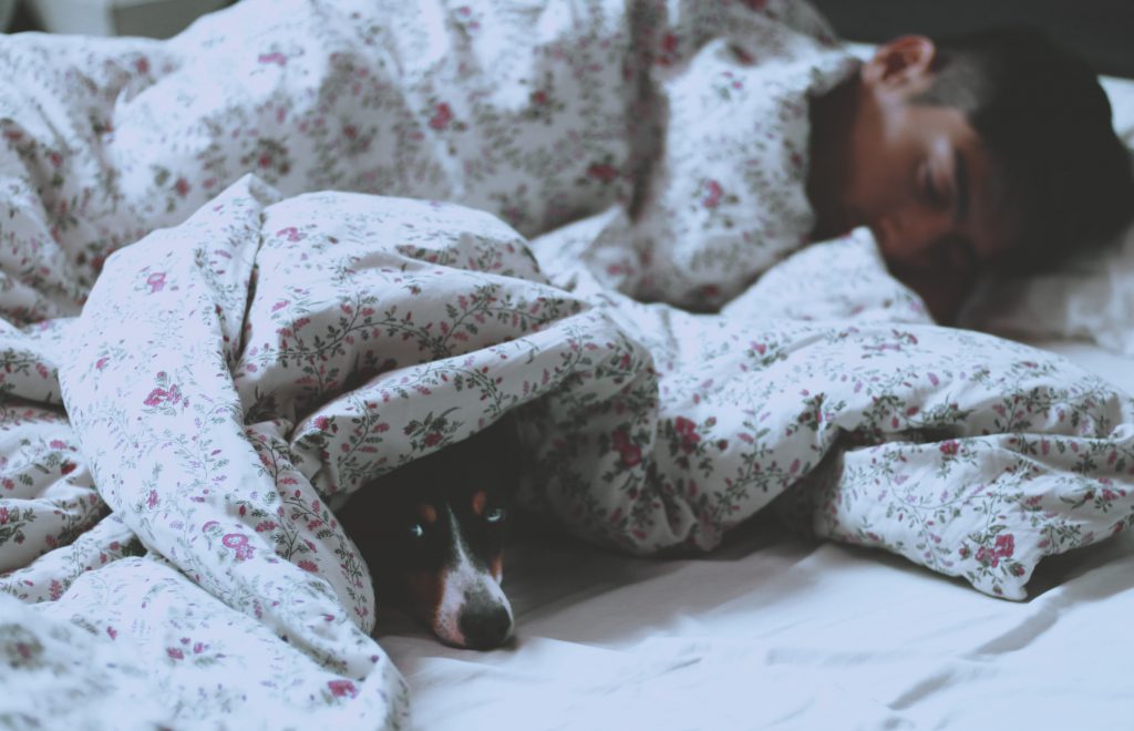 a person sleeping in the bed