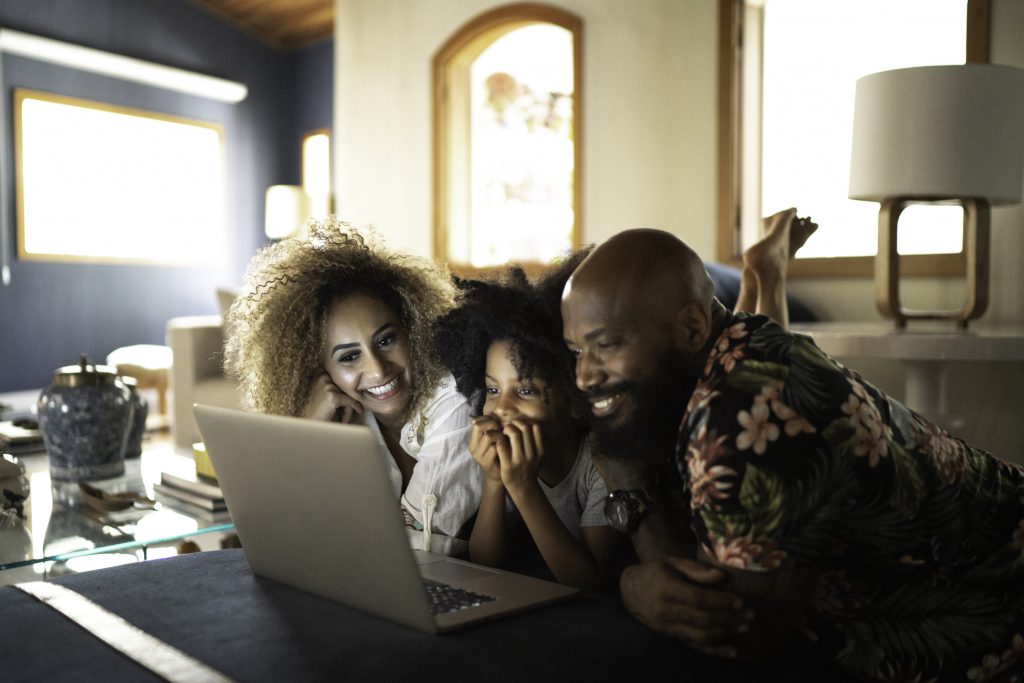 Family watching a movie on the laptop