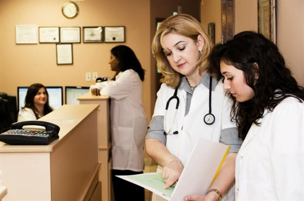 Radiologists examining a chart