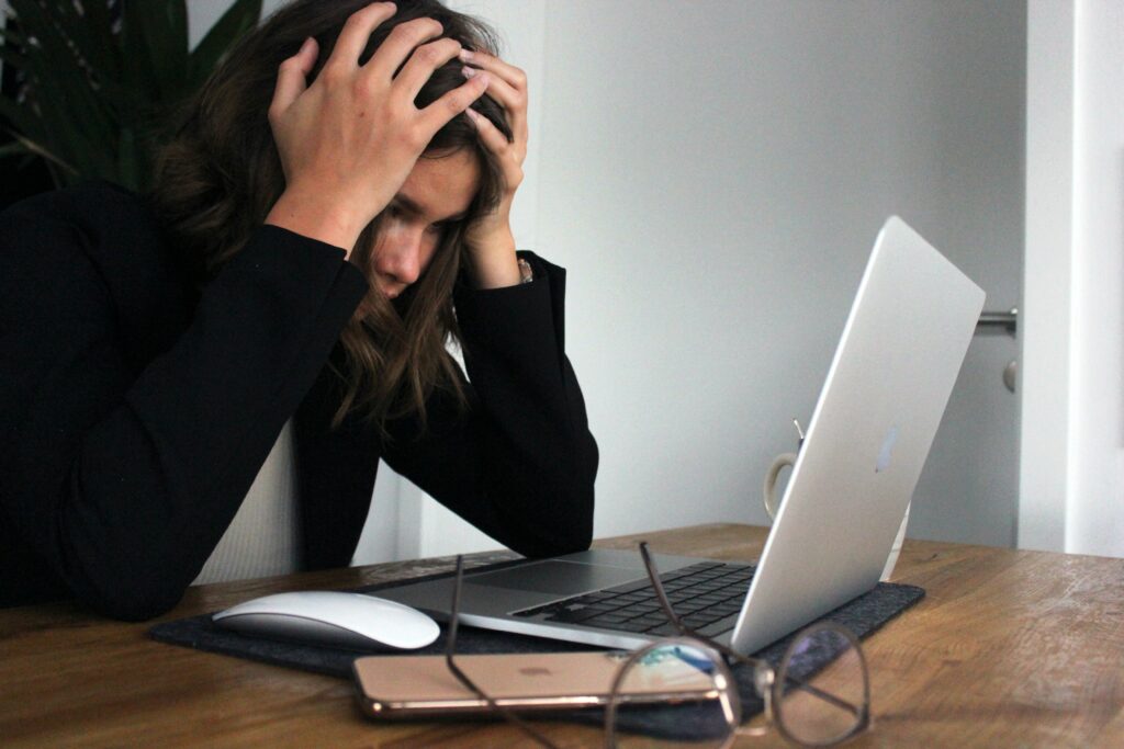 An employee experiencing frustration as she performs market research