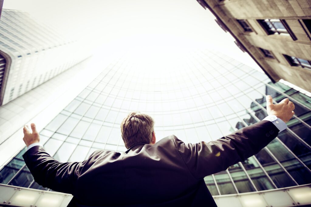 A Chief Experience Officer, or CFO, stading in front of a building