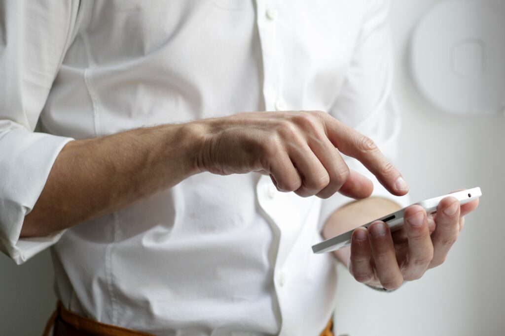 A man opening an app on his phone