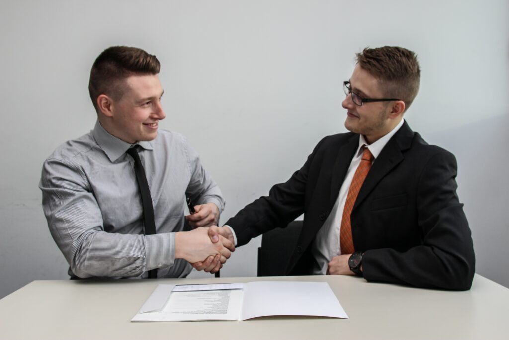 Two coworkers shaking hands