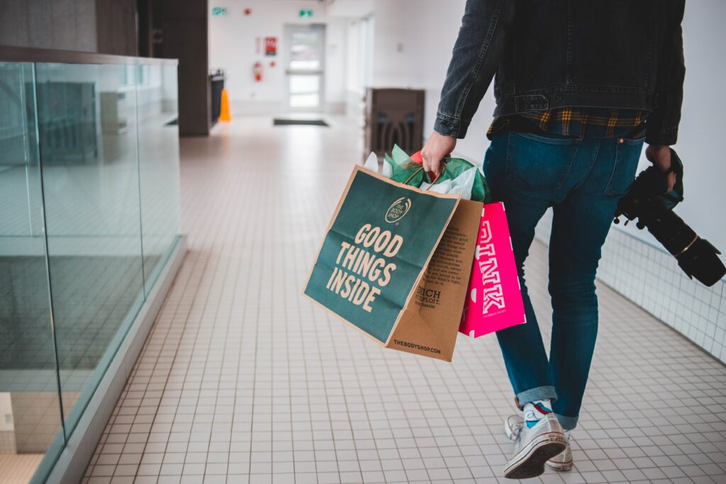 A customer carrying shopping bags