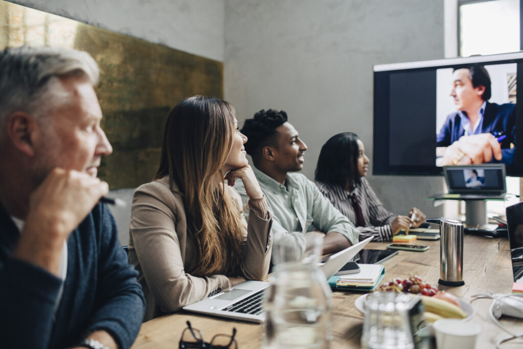 A group of loyal employees attends a meeting