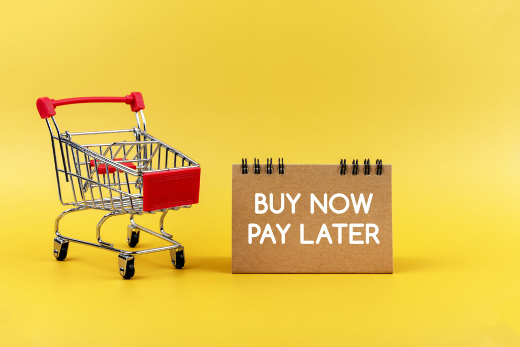 A Buy Now Pay Later sign next to a shopping cart