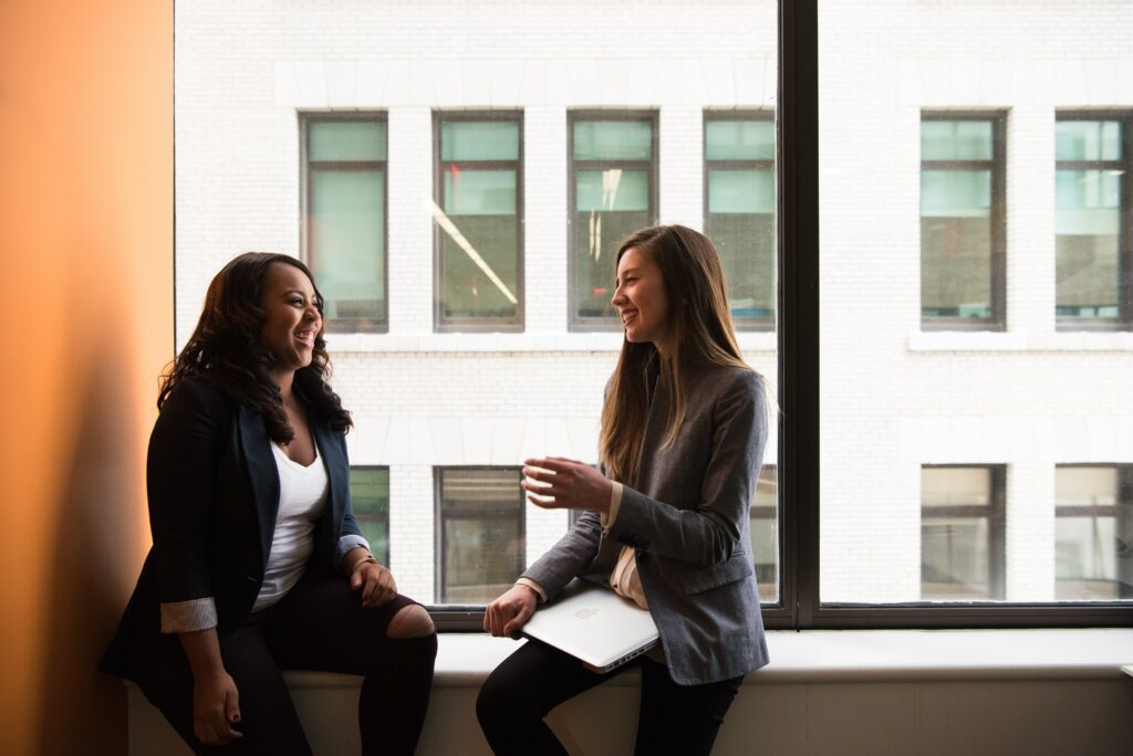 A team lead checking in with her employee to better employee engagement and improve workplace culture