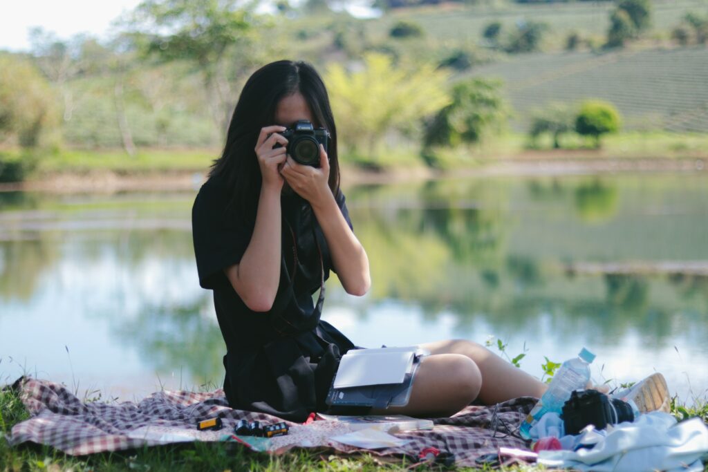 woman pursuing personal development by making time for her hobby - photography