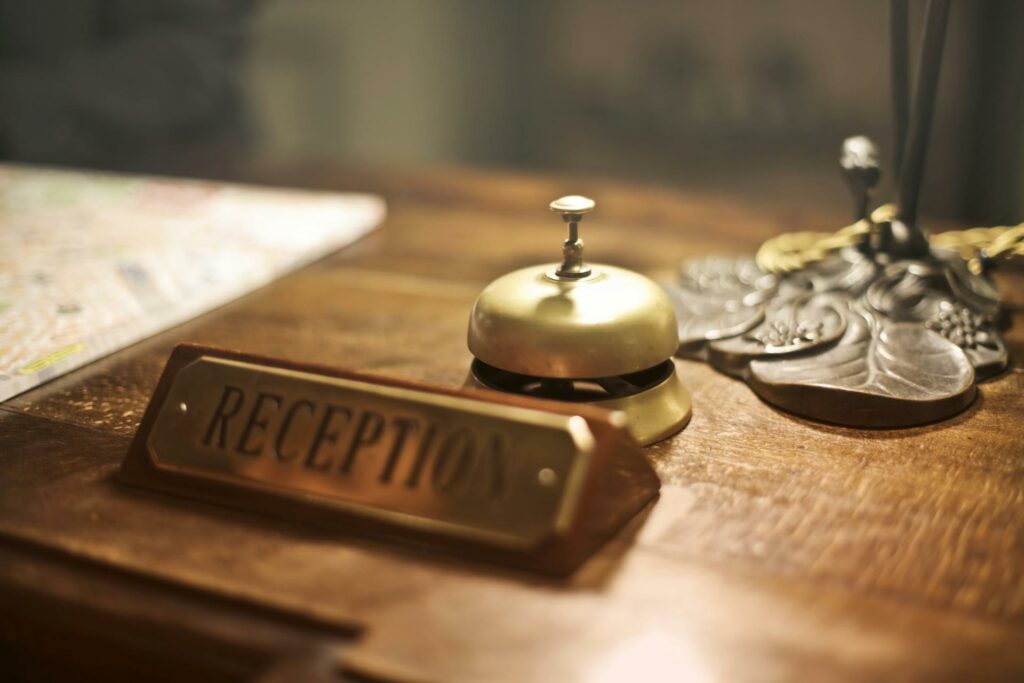 before AI guest experience - hotel reception desk bell