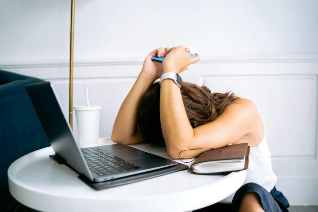 person challenged by the stress of digital networking during conflict