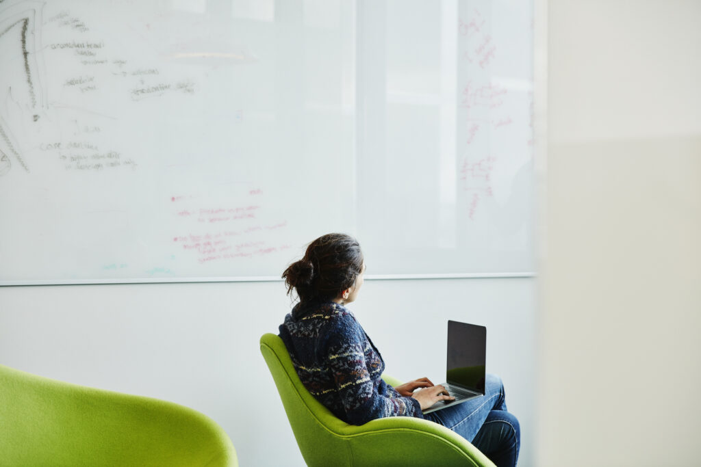 curiosity at work as a scientist studies a whiteboard