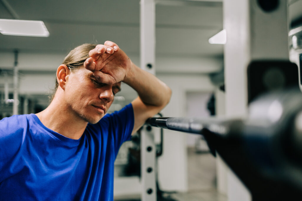 personal trainer burnout as exhausted fitness professional
