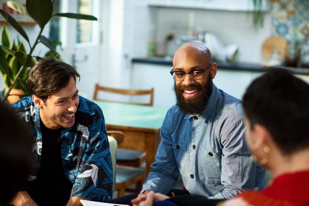 group of employees in friendly conversation, illustrating civility at work